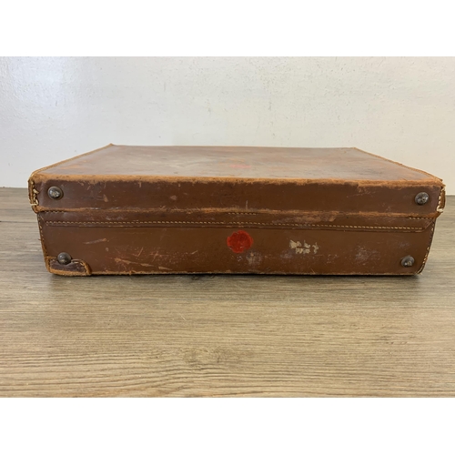 1056 - An early 20th century brown leather briefcase - approx. 11cm high x 40cm wide x 26.5cm deep