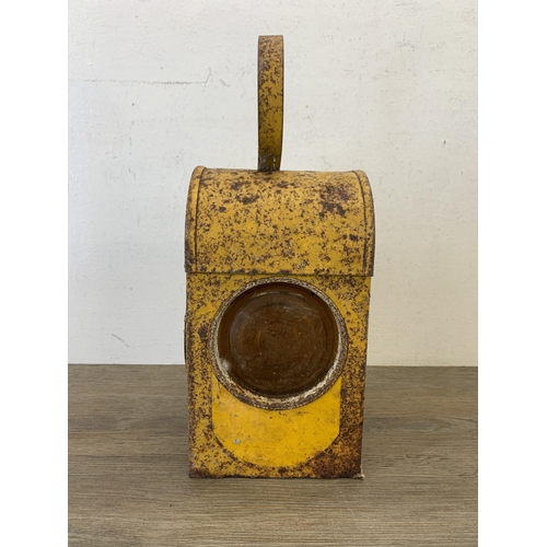 1061 - A vintage paraffin yellow painted road lantern - approx. 37cm high