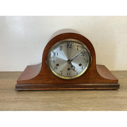 1076 - Two early/mid 20th century oak cased Napoleon hat chiming mantel clocks