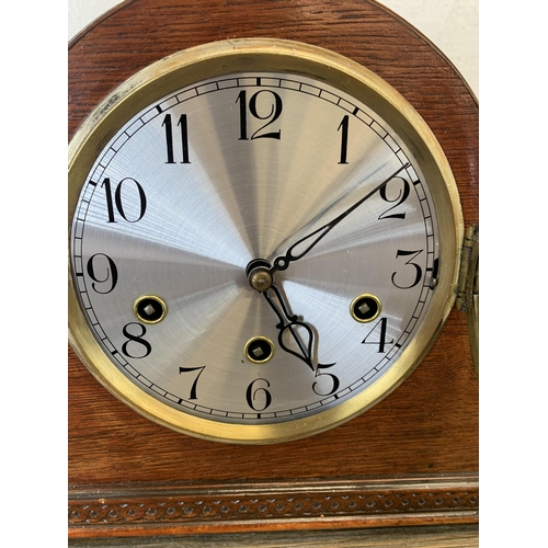 1076 - Two early/mid 20th century oak cased Napoleon hat chiming mantel clocks