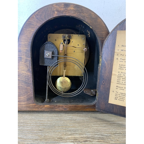 1076 - Two early/mid 20th century oak cased Napoleon hat chiming mantel clocks