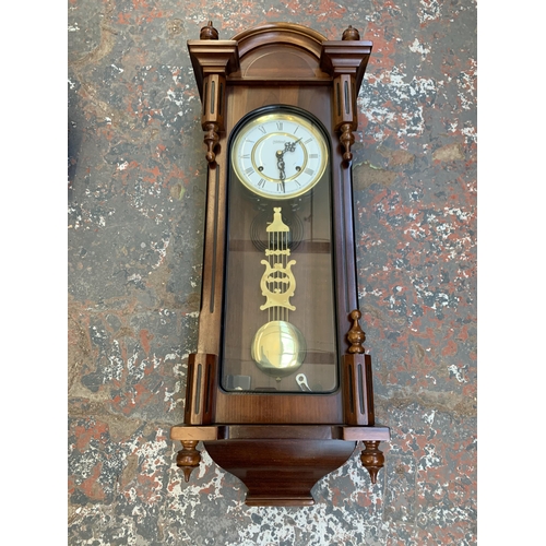 1082 - A late 20th century Highlands mahogany cased chiming Vienna wall clock - approx. 86cm long