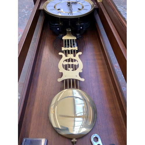 1082 - A late 20th century Highlands mahogany cased chiming Vienna wall clock - approx. 86cm long