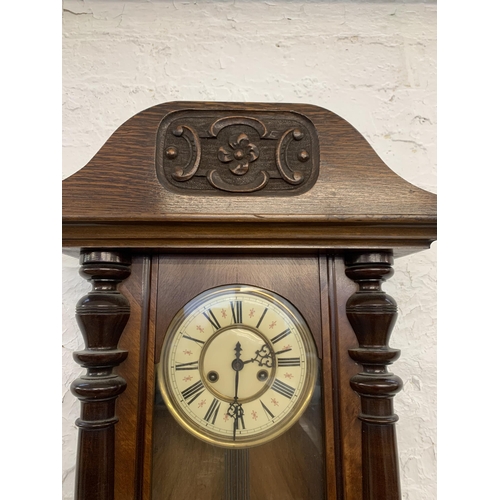 1084 - A Victorian mahogany cased Vienna chiming wall clock - approx. 106cm long x 39.5cm wide