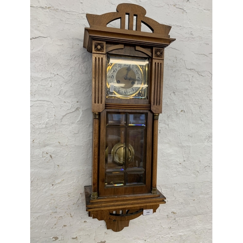 1085 - An early to mid 20th century mahogany and walnut cased chiming wall clock - approx. 80cm long x 30cm... 