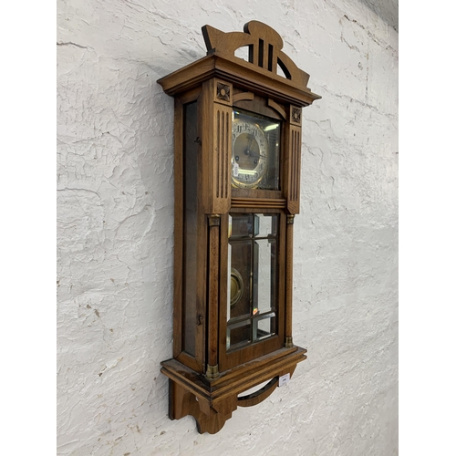 1085 - An early to mid 20th century mahogany and walnut cased chiming wall clock - approx. 80cm long x 30cm... 