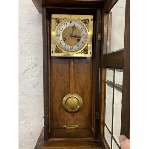 1085 - An early to mid 20th century mahogany and walnut cased chiming wall clock - approx. 80cm long x 30cm... 