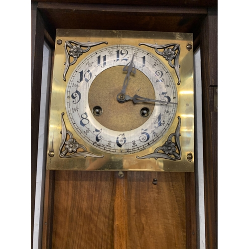 1085 - An early to mid 20th century mahogany and walnut cased chiming wall clock - approx. 80cm long x 30cm... 