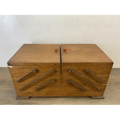 1086 - A mid 20th century oak cantilever sewing box