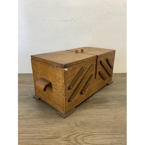 1086 - A mid 20th century oak cantilever sewing box