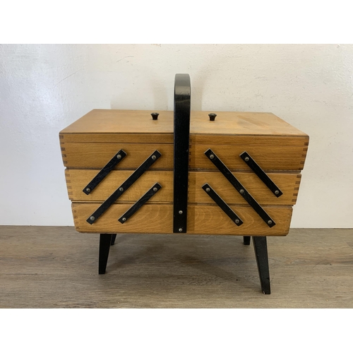 1087 - A mid 20th century beech and ebonised cantilever sewing box - approx. 46cm high