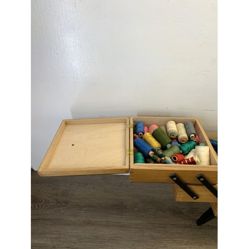 1087 - A mid 20th century beech and ebonised cantilever sewing box - approx. 46cm high