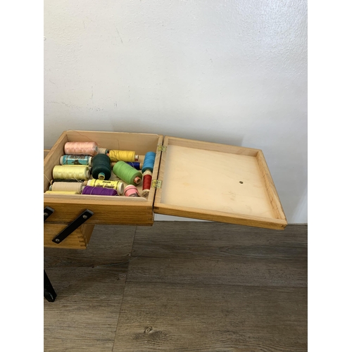 1087 - A mid 20th century beech and ebonised cantilever sewing box - approx. 46cm high