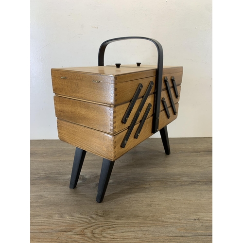 1087 - A mid 20th century beech and ebonised cantilever sewing box - approx. 46cm high