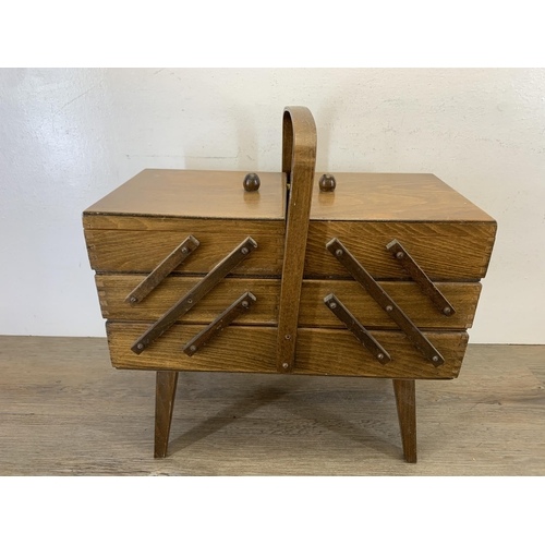 1088 - A mid 20th century plywood cantilever sewing box - approx. 44cm high