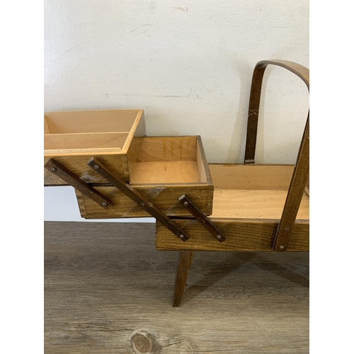 1088 - A mid 20th century plywood cantilever sewing box - approx. 44cm high