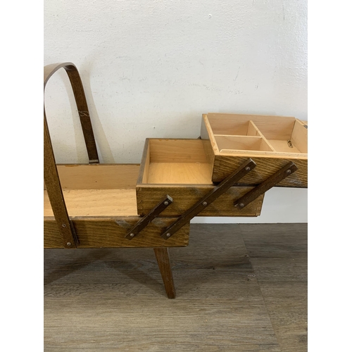 1088 - A mid 20th century plywood cantilever sewing box - approx. 44cm high