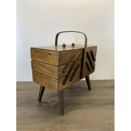 1088 - A mid 20th century plywood cantilever sewing box - approx. 44cm high