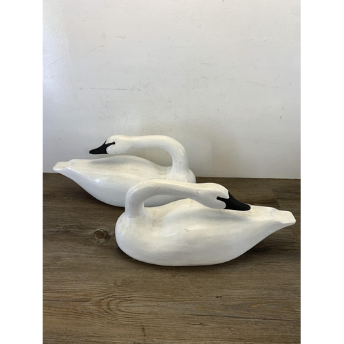 1089 - A pair of 1980s hand carved and painted Rangeley lake decoy swans by Karen Aumick, dated 1988 with o... 