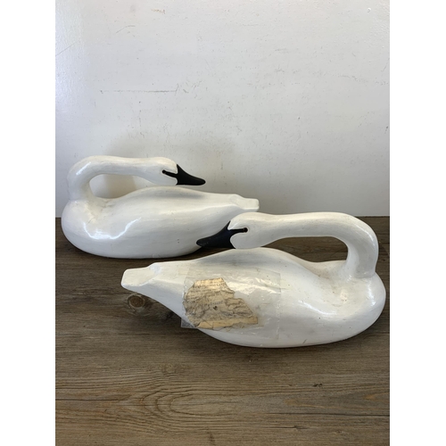 1089 - A pair of 1980s hand carved and painted Rangeley lake decoy swans by Karen Aumick, dated 1988 with o... 