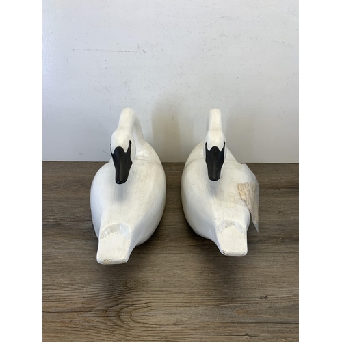 1089 - A pair of 1980s hand carved and painted Rangeley lake decoy swans by Karen Aumick, dated 1988 with o... 