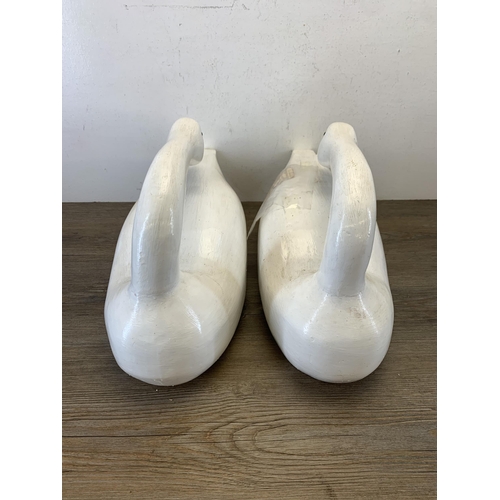 1089 - A pair of 1980s hand carved and painted Rangeley lake decoy swans by Karen Aumick, dated 1988 with o... 