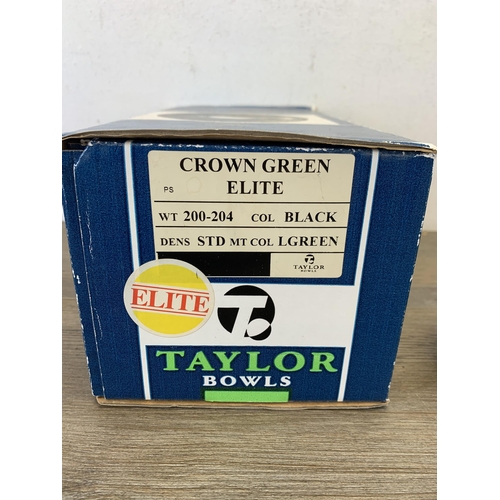 1090 - A pair of boxed Thomas Taylor crown green bowls and jack