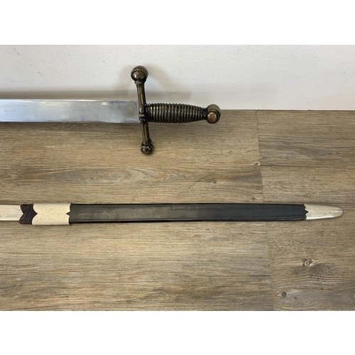 1081 - Two decorative ornamental swords - largest approx. 76cm long