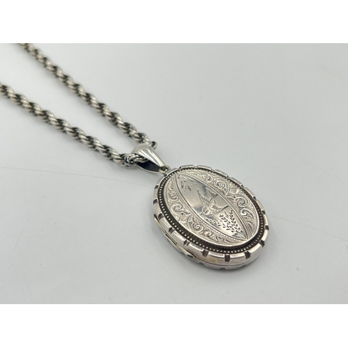 2331 - A Victorian white metal locket and chain - approx. gross weight 24g