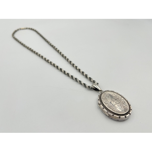 2331 - A Victorian white metal locket and chain - approx. gross weight 24g