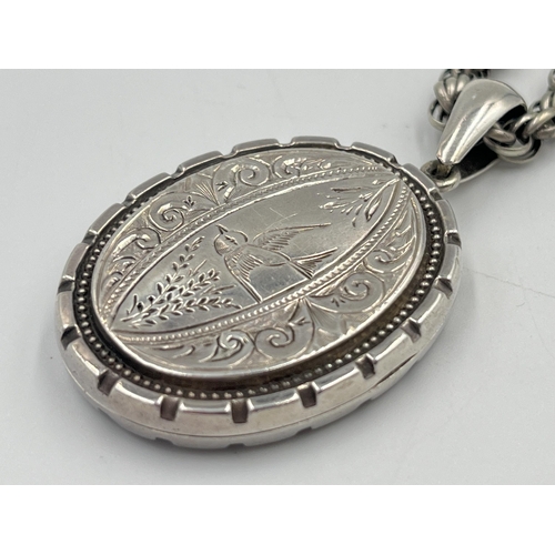 2331 - A Victorian white metal locket and chain - approx. gross weight 24g