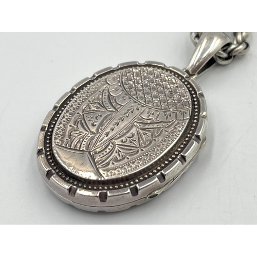 2331 - A Victorian white metal locket and chain - approx. gross weight 24g