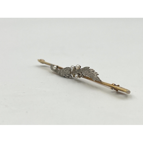 2332 - A late 19th/early 20th century 15ct gold and platinum seed pearl set foliate brooch - approx. gross ... 