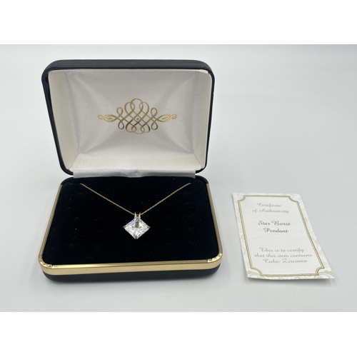 2357 - A 9ct gold cubic zirconia star burst pendant necklace with certificate of authenticity - approx. gro... 