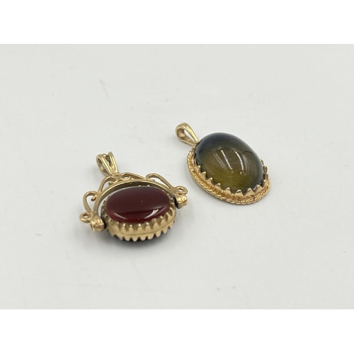 2358 - Two pieces of jewellery, one hallmarked 9ct gold black onyx pendant and one yellow metal carnelian a... 