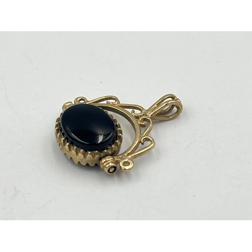 2358 - Two pieces of jewellery, one hallmarked 9ct gold black onyx pendant and one yellow metal carnelian a... 