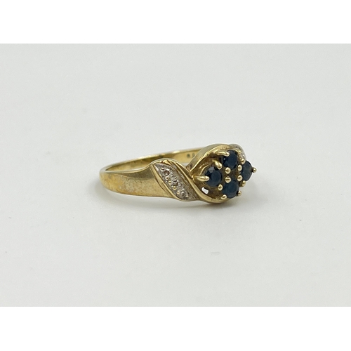 2366 - A 9ct gold sapphire and diamond dress ring, size O - approx. gross weight 2.4g