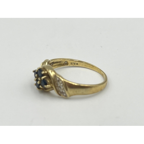 2366 - A 9ct gold sapphire and diamond dress ring, size O - approx. gross weight 2.4g