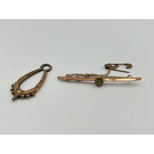 2373 - Two pieces of jewellery, one 9ct gold peridot set brooch with base metal pin and one yellow metal ea... 