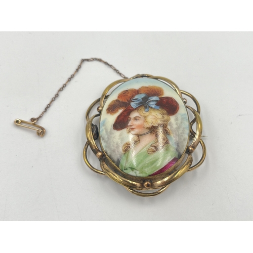 2379 - A yellow metal framed porcelain portrait brooch with base metal pin - approx. gross weight 21g and 7... 