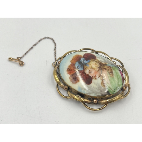 2379 - A yellow metal framed porcelain portrait brooch with base metal pin - approx. gross weight 21g and 7... 