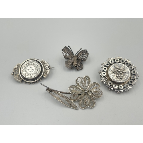 2381 - Four silver brooches to include hallmarked Chester foliate, Maltese .917, .925 butterfly etc. - appr... 