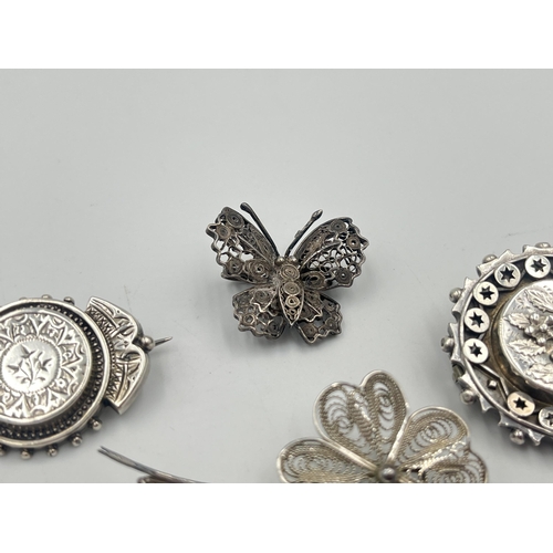 2381 - Four silver brooches to include hallmarked Chester foliate, Maltese .917, .925 butterfly etc. - appr... 