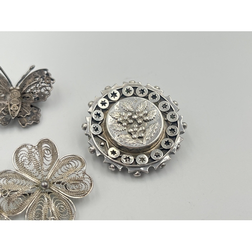 2381 - Four silver brooches to include hallmarked Chester foliate, Maltese .917, .925 butterfly etc. - appr... 