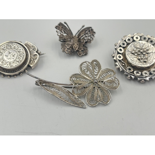 2381 - Four silver brooches to include hallmarked Chester foliate, Maltese .917, .925 butterfly etc. - appr... 