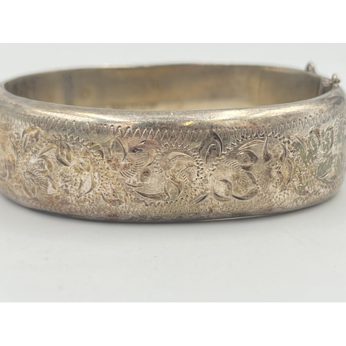 2398 - A hallmarked Birmingham silver foliate etched bangle - approx. gross weight 28g