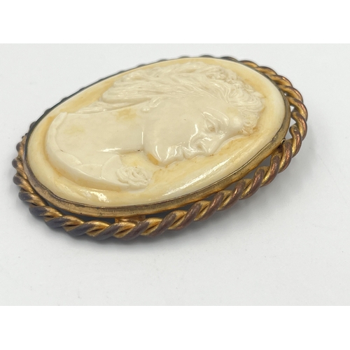 2400 - A vintage yellow metal framed ivorine cameo brooch - approx. 5cm high x 4cm wide