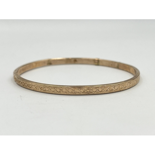 2401 - A hallmarked Birmingham 9ct gold bangle - approx. gross weight 3.8g