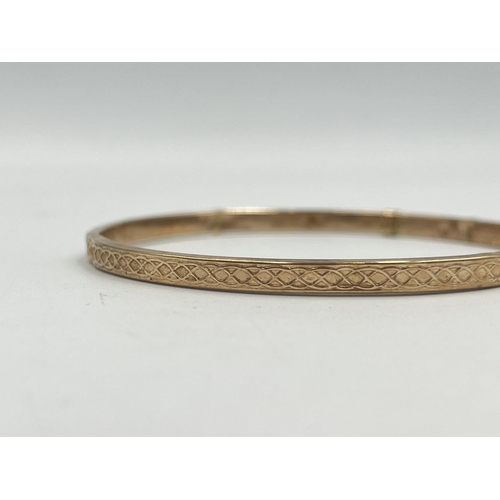 2401 - A hallmarked Birmingham 9ct gold bangle - approx. gross weight 3.8g