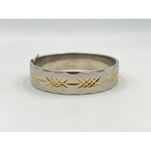 2401A - An 18ct gold plated etched bangle